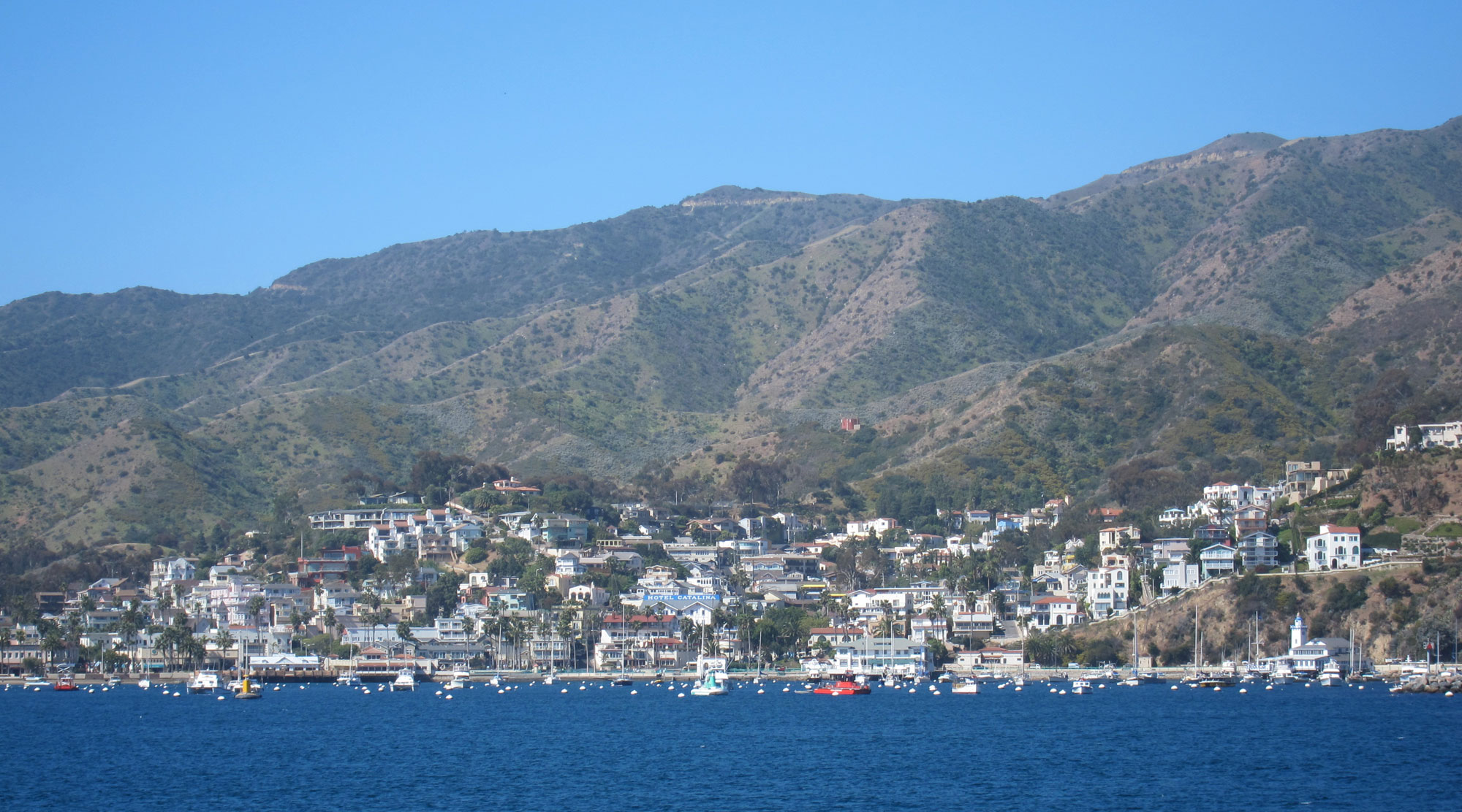 The city of Avalon on the shore of Santa Catalina Island as seen from the ocean.